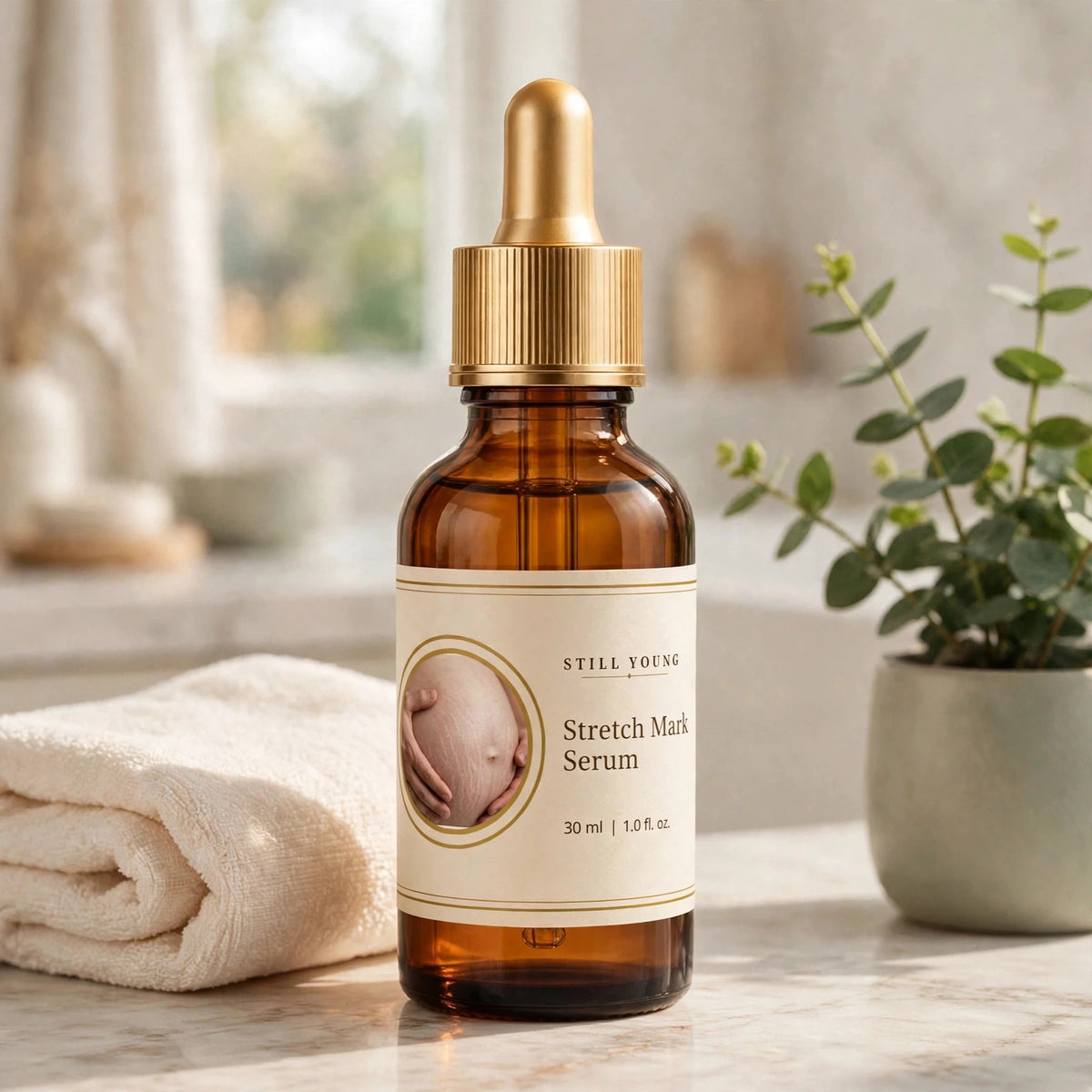 Still Young Stretch Mark Serum 30ml bottle on a bathroom vanity with towel and plant